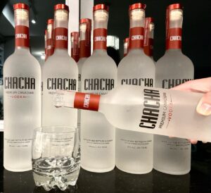 Pour CHACHA vodka into a glass.